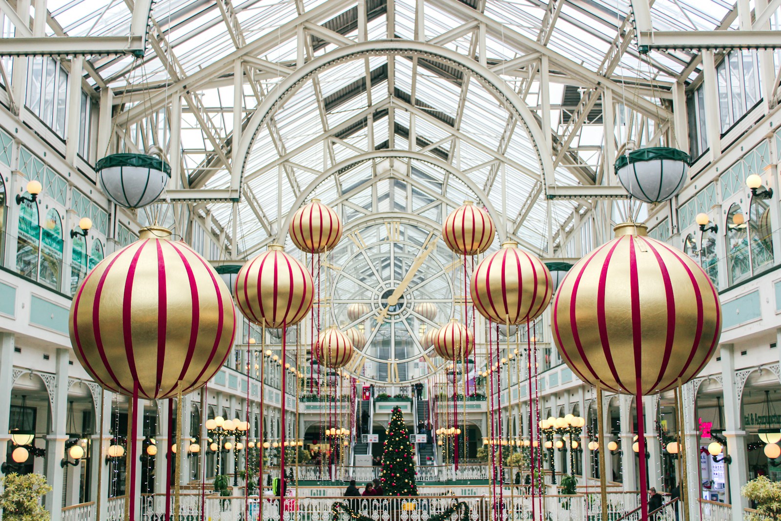 a mall filled with lots of christmas decorations